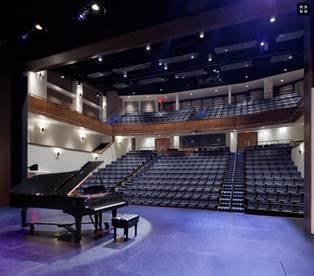 The auditorium seats 472 audience members.