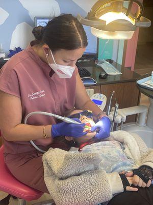 My daughter happily getting her teeth brushed.