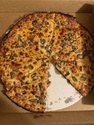 Large thin crust mushroom pizza.