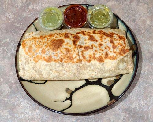 Mexican Sausage (chorizo) breakfast burrito onn a 8" plate. Big burrito!