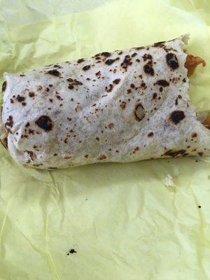 Half of my breakfast burrito I appreciate the charing on the tortilla makes for fond memories of my childhood lol