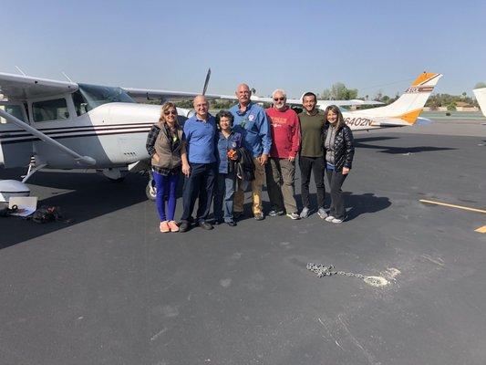 Part of a short term Mission team with two of our Mission aircraft in the background. A Cessna TI206 and a Cessna T210