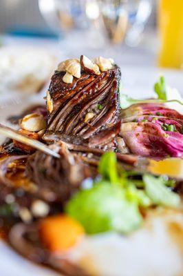 CABERNET BRAISED SHORT RIB
 Spring Onions, Sunchoke, Hazelnuts, Parmesan, Balsamic