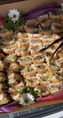 Beautifully packaged catering tray of variety sandwiches