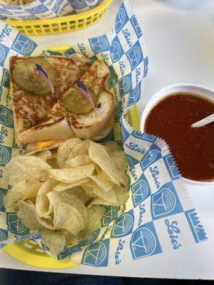 grilled cheese with chips and a cup of chili