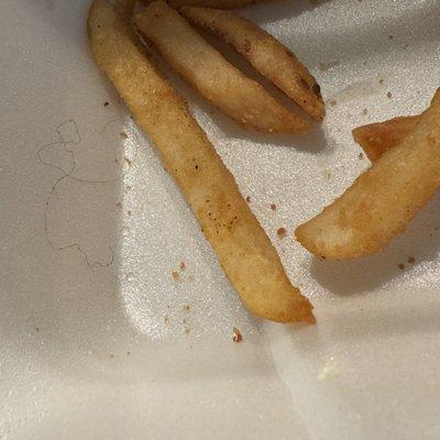 A piece of hair in the tenders and fries