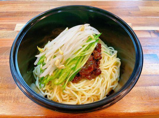 Zha Jiang Mian
 
 Homemade Beijing-style pork with mushrooms and dark soy paste, topped with cucumber shreds and bean sprouts