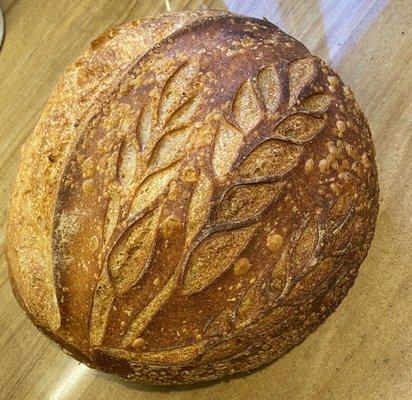 Country Sourdough boule of classic white sourdough. Beautiful craftsmanship, amazing chewy and crusty texture and fantastic flavor!