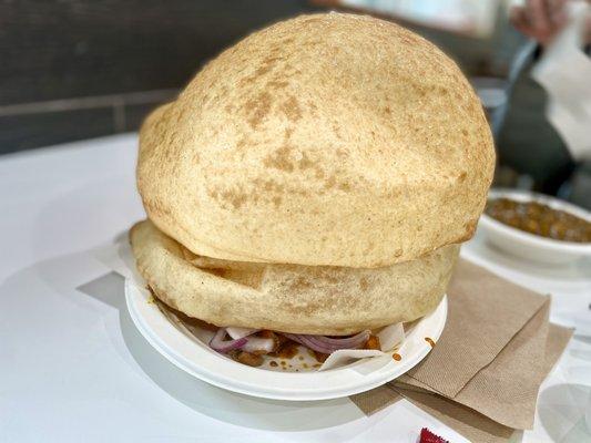 Perfectly round balls of fried dough - goodness at its best! Chole Bhatura