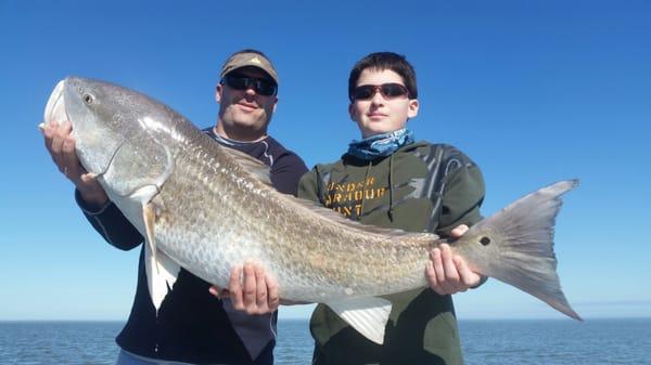 Father and son with monster bull red!