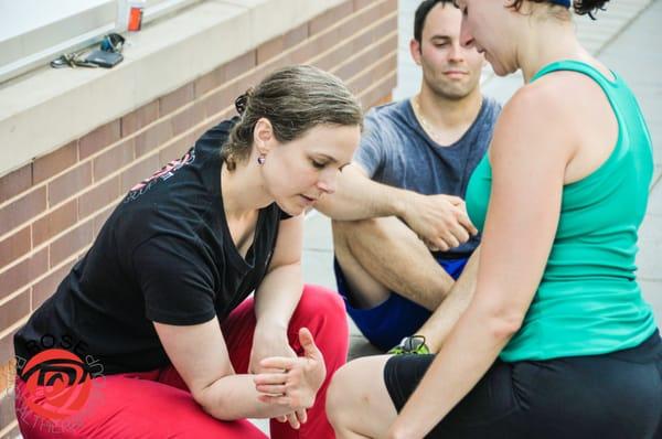 Claire proving an injury prevention seminar to runners at Vida Fitness.