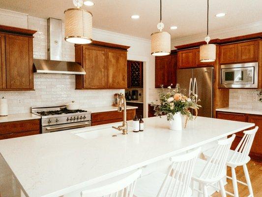 Semi kitchen update with beautiful quartz countertops. Countertops and tile were purchased through our company and installed by us as well.