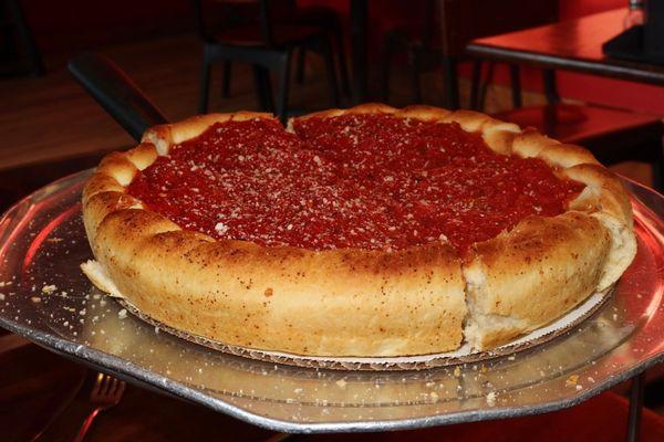 Jimano's specializes in iconic Chicago deep-dish pizzas - a hearty affair with a one-inch-thick crust baked in a pan.