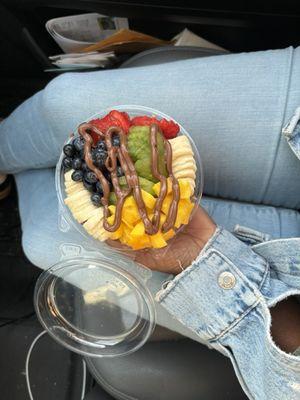 Açaí, mango mix w/ mango's, banana, blueberries, strawberries and granola with a drizzle of Nutella.