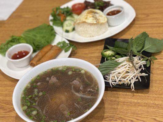 P2. Rib Eye Steak/Pho Tai C1. Grilled Pork Steamed Rice (COM TRANG THIT NUONG) A1. Egg Rolls (CHA GIO)