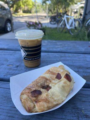 Bacon and Gouda croissant and iced café con leche