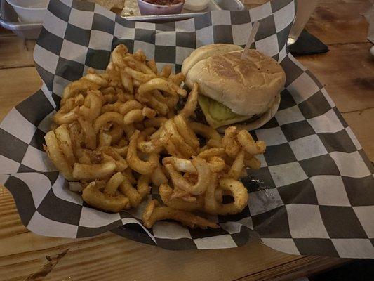 Cheddar cheese burger with curly fries.