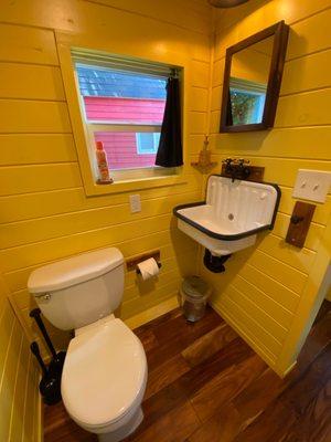 Toilet and sink in the bathroom. The bathroom felt very spacious for a tiny home!