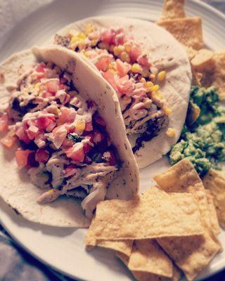 Cajun fish taco  Topped with sweet corn  Pico DE Gaia and a homemade Cajun Mayo