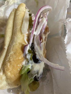 This is a Turkey oven roasted with onions, lettuce, black olives, pickles,American cheese, extra mayo,extra oil and vinegar