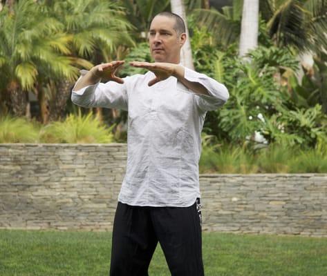 Hagai teaching a Qigong breath