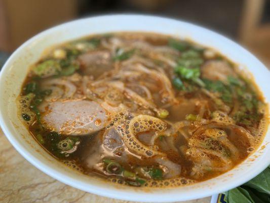 Spicy beef soup with yellow noodle