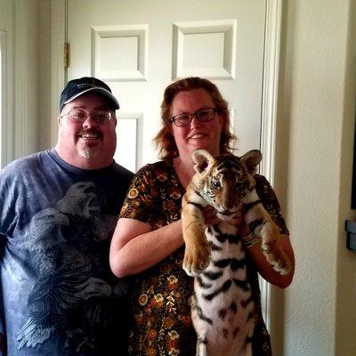 The wife and I with a tiger cub