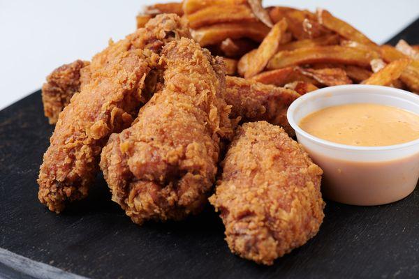 our chicken wings with a side of soulnluv sauce and hose cut fries.