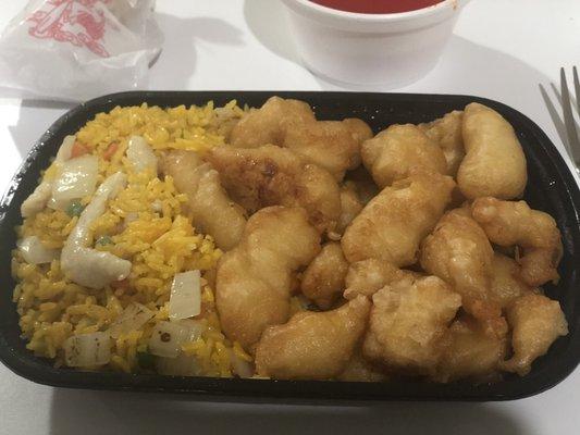 Sweet and sour chicken special combination platter with chicken fried rice (substitute for pork fried rice) and an egg roll.