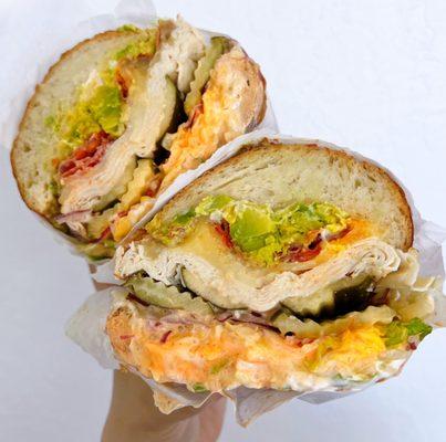 #8 Chicken Delight: Chicken, bacon, sub mozz for habanero jack, grated parm, sriracha, mayo, 1000 island, avocado, sourdough | $13.99