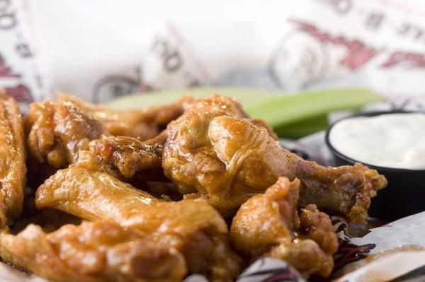 Our delicious wings, accompanied by fresh celery.