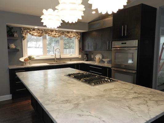 Brushed Super White countertops with large island.