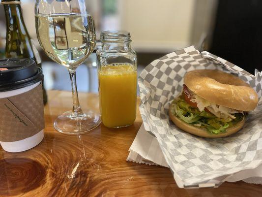 Jalapeño popper bagel with added meat. An delicious dbl shot espresso and a mimosa (oj on the side)