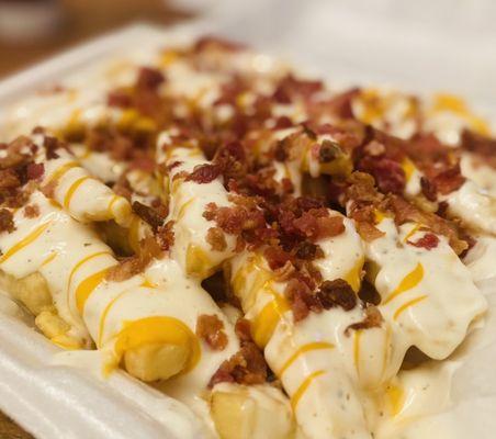 Bacon Ranch Cheese fries comes in a med or Large size only. The Large comes in a full side styrofoam container.