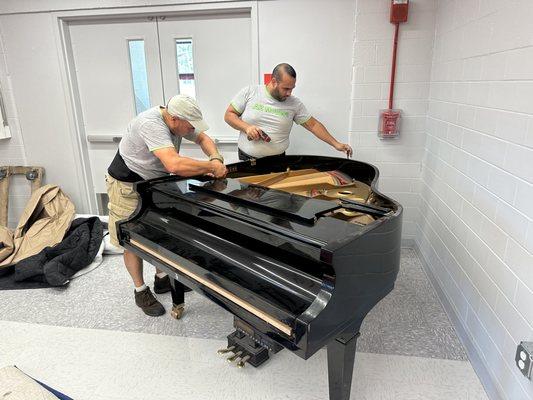 Moving baby grand piano