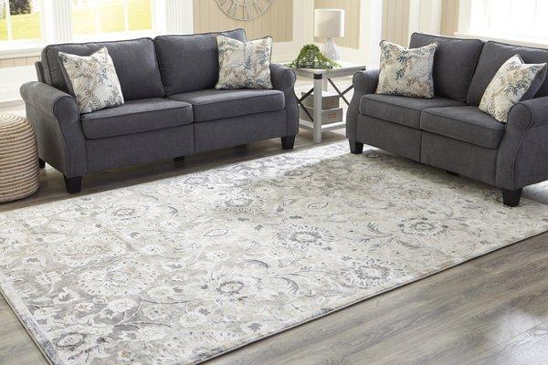 Living room set with area rug from Ashley