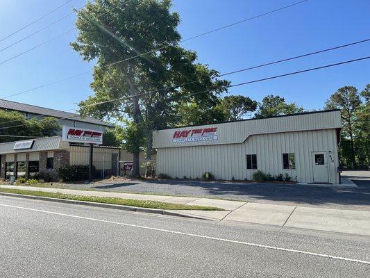 their auto repair building (to right) is adjacent to their tire repair building (to left) .... separate driveways