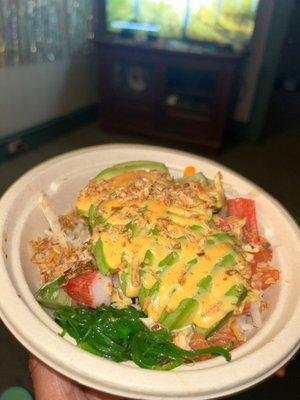 Poke Bowl with Spicy Salmon & Kani .. cucumbers, seaweed salad, avocado, & sweet chili sauce.