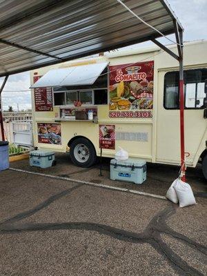 Food truck with a covered seating area