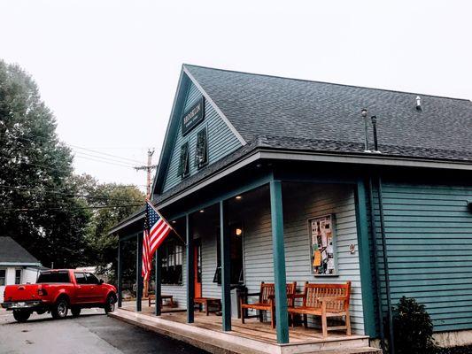 The rebuilt Brooklin General Store is lovely Maine blue, cozy inside and out with tables and benches.