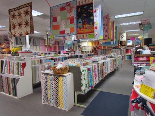 Majority of floor space is full of designer quilting cottons.