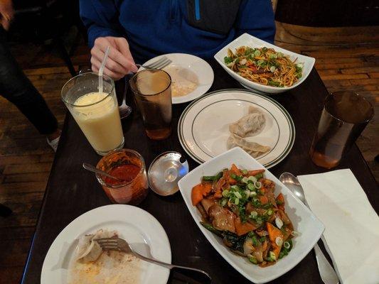 Mango lassi, hot sauce, boo: beef chowmein, moi: chicken thukleb and lots of water.