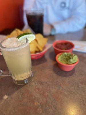 Margarita on the rocks.  Chips, salsa and guacamole