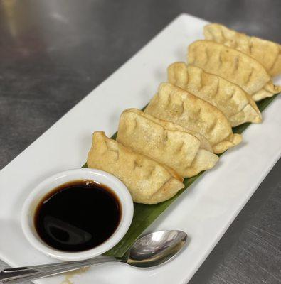 Potstickers served with ginger sauce