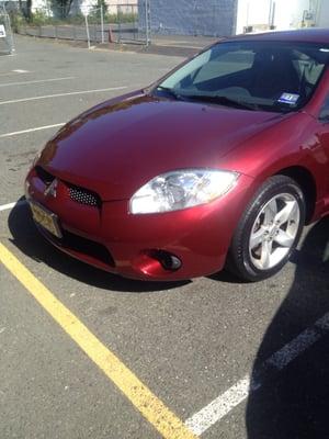 2007 Mitsubishi Eclipse after accident. The bumper and hood were smashed. This old car now looks brand new!!