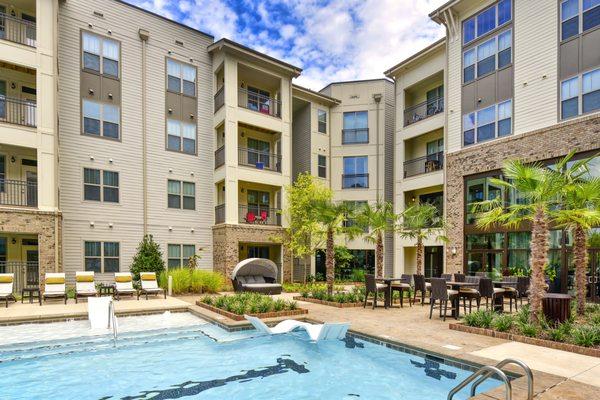 Resort style pool and apartments with pool views