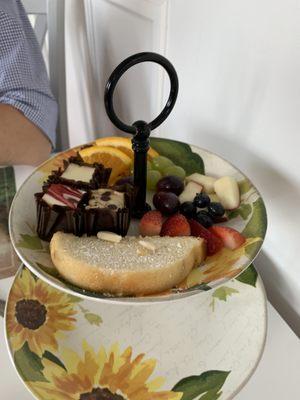 Mini Cheese cake trio on the left, Fresh fruit, and the almond cake in the front.