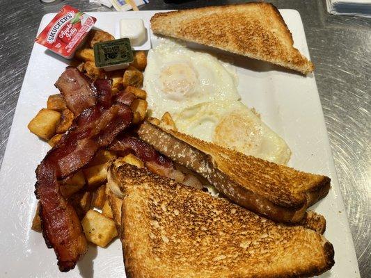 Eggs, potatoes, bacon, white toast