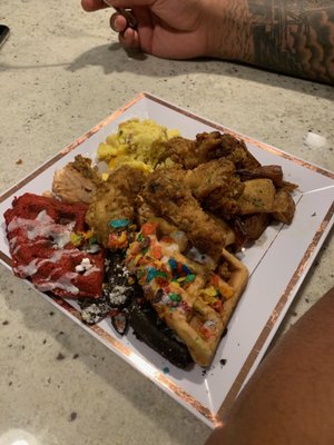 Fruity pebble, Oreo, red velvet waffles. Home fries, eggs, fried chicken