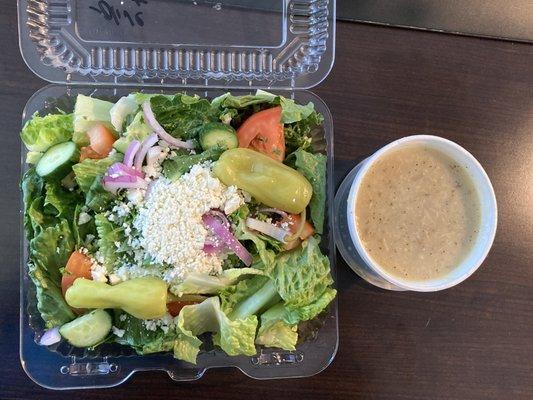 Small Greek Salad with cup of lemon rice